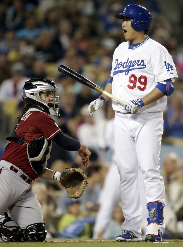 Los Angeles Dodgers' Hyun-jin Ryu (99), of South Korea, reacts to a strike call by the umpire while batting against the Arizona Diamondbacks during the second inning of a baseball game on Wednesday, Sept. 11, 2013, in Los Angeles. (AP Photo/Jae C. Hong)