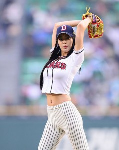 Clara winds up to throw the first pitch at a baseball game in Jamsil, southern Seoul, on May 3, wearing figure-hugging white leggings. She found her name going viral following the event. / Korea Times file
