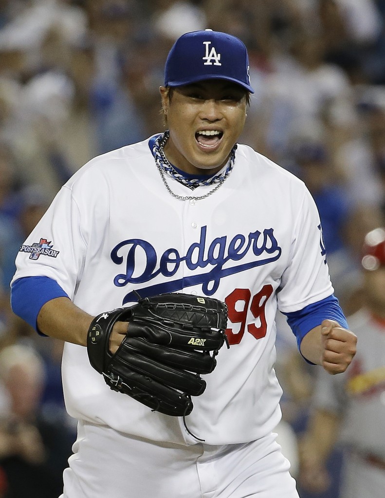 Los Angeles Dodgers starting pitcher Hyun-Jin Ryu celebrates after getting the last out to end the seventh inning of Game 3 of the National League baseball championship series against the St. Louis Cardinals, Monday, Oct. 14, 2013, in Los Angeles. (AP Photo/David J. Phillip)