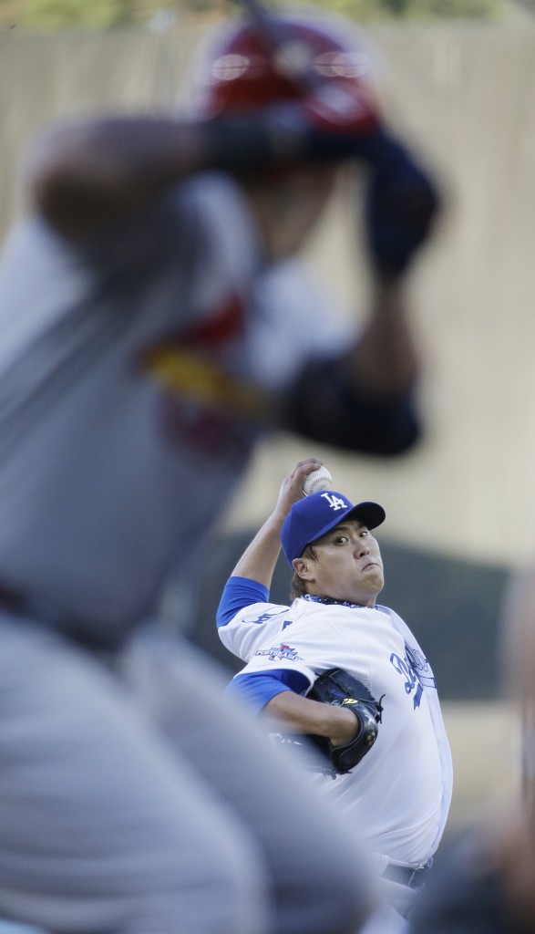 Los Angeles Dodgers starting pitcher Hyun-Jin Ryu throws during the first inning of Game 3 of the National League baseball championship series Monday, Oct. 14, 2013, in Los Angeles. (AP Photo/David J. Phillip)