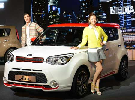 Models pose next to the all-new Soul during a launch event at W Seoul Walkerhill Hotel, Tuesday. / Courtesy of Kia Motors