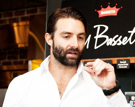 Paul Bassett, an Australian world champion barista, speaks at a store of the coffee chain named after him during a visit to Seoul. The coffee chain selects beans, roasts and brews the coffee according to Bassett’s standards and techniques. / Courtesy of Maeil Dairies