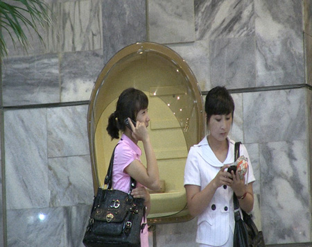 North Korean women use their smartphones in Pyongyang, North Korea, in August. / Courtesy of Medical Aid for Children