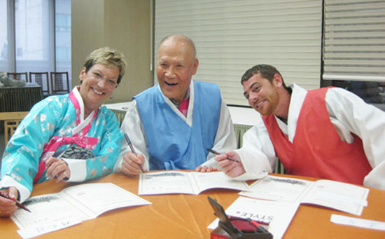 Chung Pil-ki, center, poses with Carolyn Worley Green, left, the daughter of Charles E. Worley and her son Joshua Worley Green. 
/ Courtesy of Chung Pil-ki