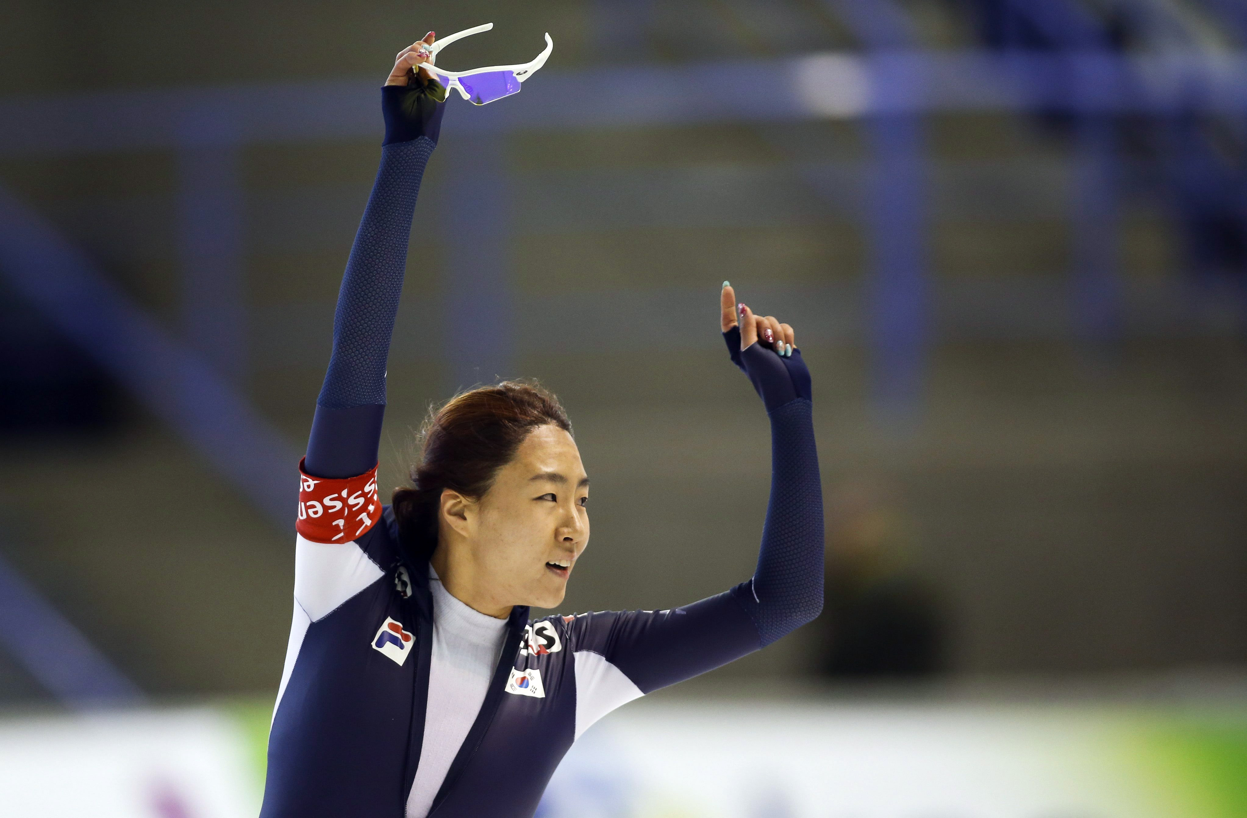 South Korea's Lee Sang-hwa celebrates her new world record during the ladies 500-meter competition at the World Cup speedskating event in Calgary, Alberta, Saturday, Nov. 9, 2013. Lee's time of 36.74 seconds at the Olympic Oval in Calgary erased the previous mark of 36.80 she'd set in Calgary on Jan. 20. (AP Photo/The Canadian Press, Jeff McIntosh)