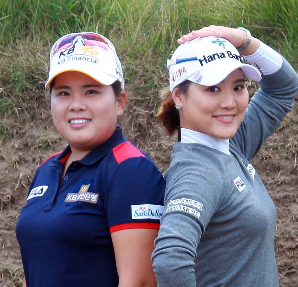 Park Inbee, left, and Ryu So Yeon, posed inside a bunker at British Women's Open. They finished 1-2 among Koreans on the money list this year. (Yonhap)