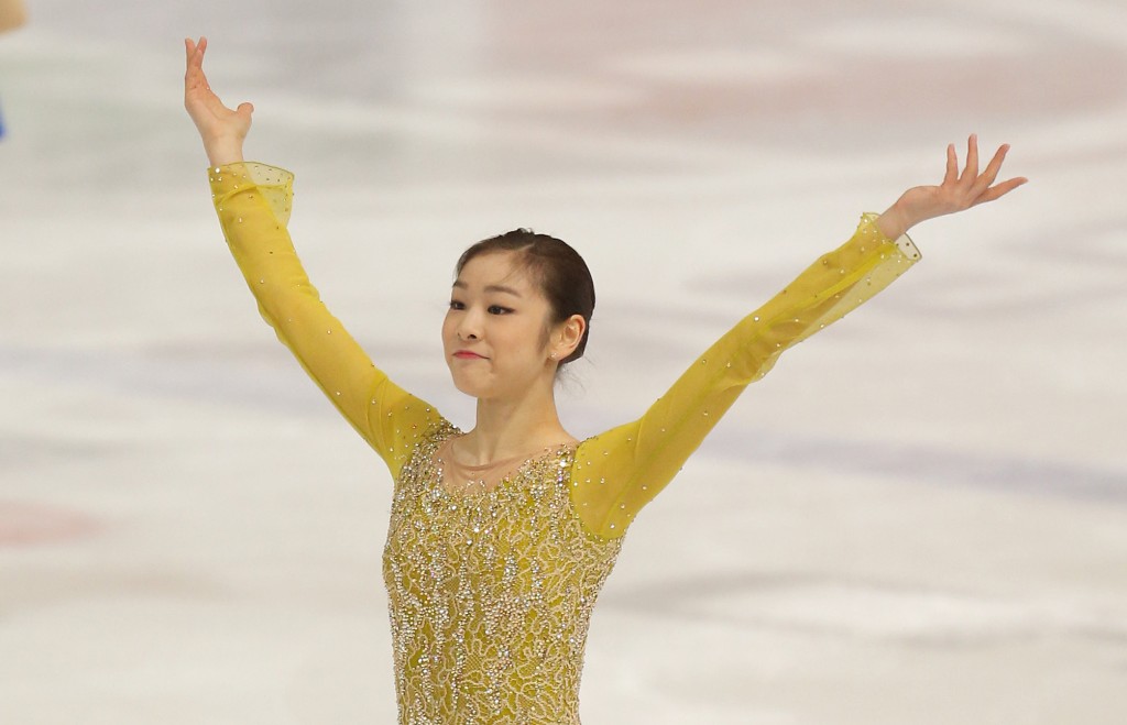 South Korea's Kim Yu-Na salutes the audience after performing in the short program of Golden Spin figure skating competition in Zagreb, Croatia, Friday, Dec. 6, 2013. (AP Photo/Darko Bandic)