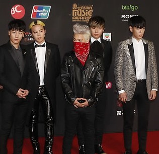 South Korean music band Big Bang poses poses for photographers on the red carpet of the South Korean Mnet Asian Music Awards in Hong Kong Friday, Nov. 22, 2013. (AP Photo/ Yonhap)