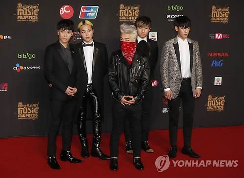 South Korean music band Big Bang poses poses for photographers on the red carpet of the South Korean Mnet Asian Music Awards in Hong Kong Friday, Nov. 22, 2013. (AP Photo/ Yonhap)
