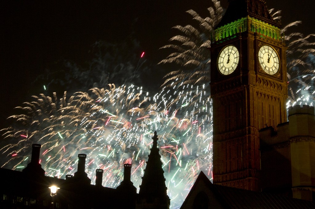 Fireworks explode over the Houses of Parliament, including Queen Elizabeth II tower which holds the bell known as Big Ben as London celebrates the arrival of New Years Day Wednesday, Jan. 1, 2014. The annual firework display is the culmination of the New Year's Eve celebrations.(AP Photo/Alastair Grant)