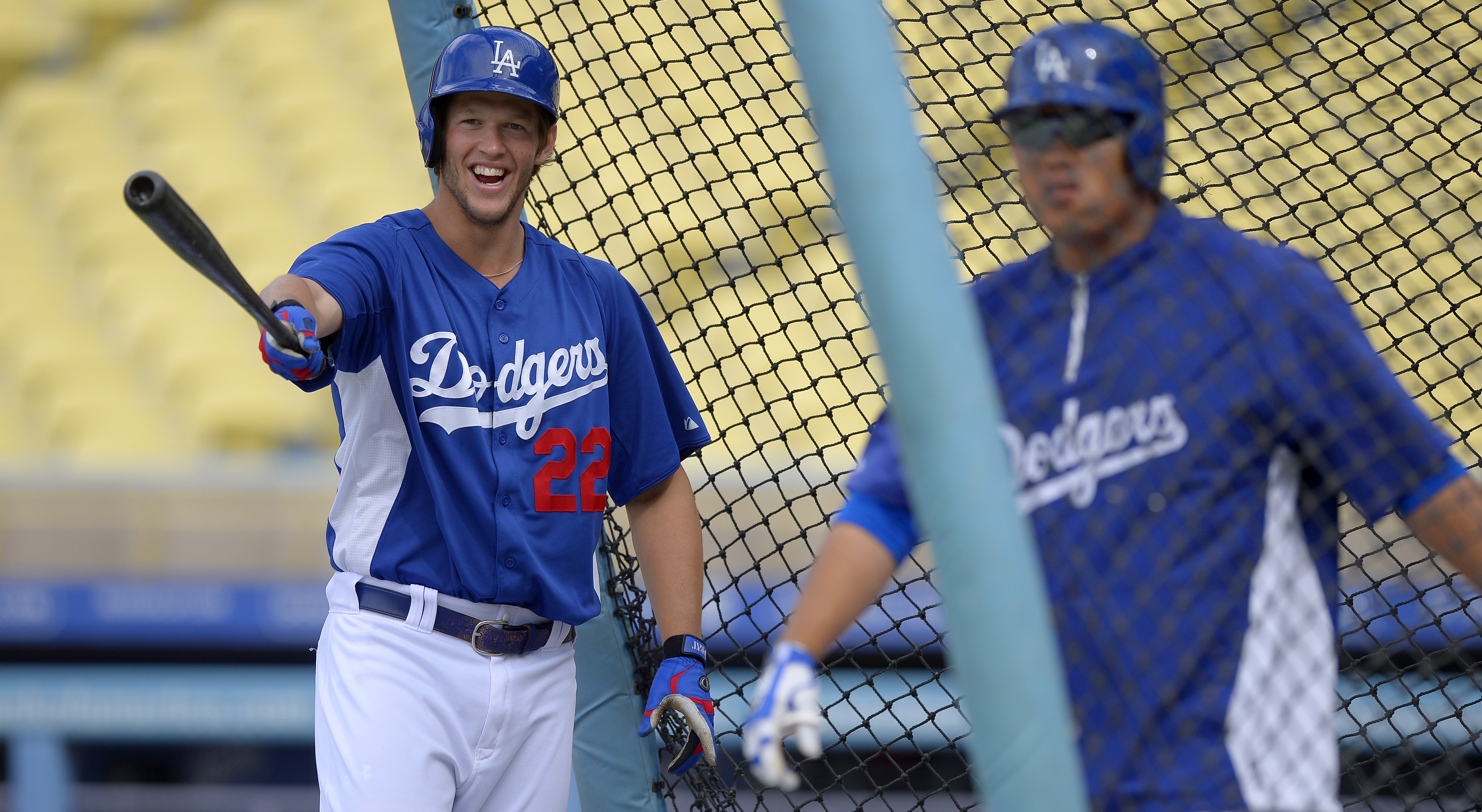 Clayton Kershaw. left, during batting practice with Ryu Hyun-jin here, has a lot to smile about. (AP)
