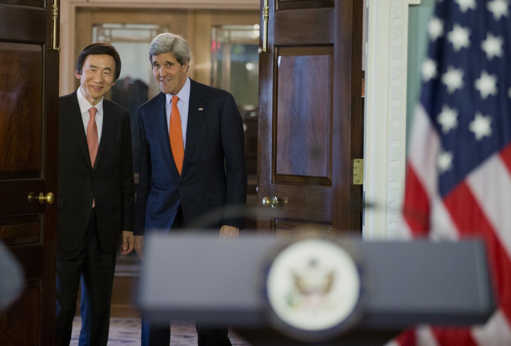 Secretary of State John Kerry, right, and South Korean Foreign Minister Yun Byung-se arrive to deliver statements after a meeting at the State Department in Washington, Tuesday, Jan. 7, 2014. (AP Photo/ Evan Vucci)