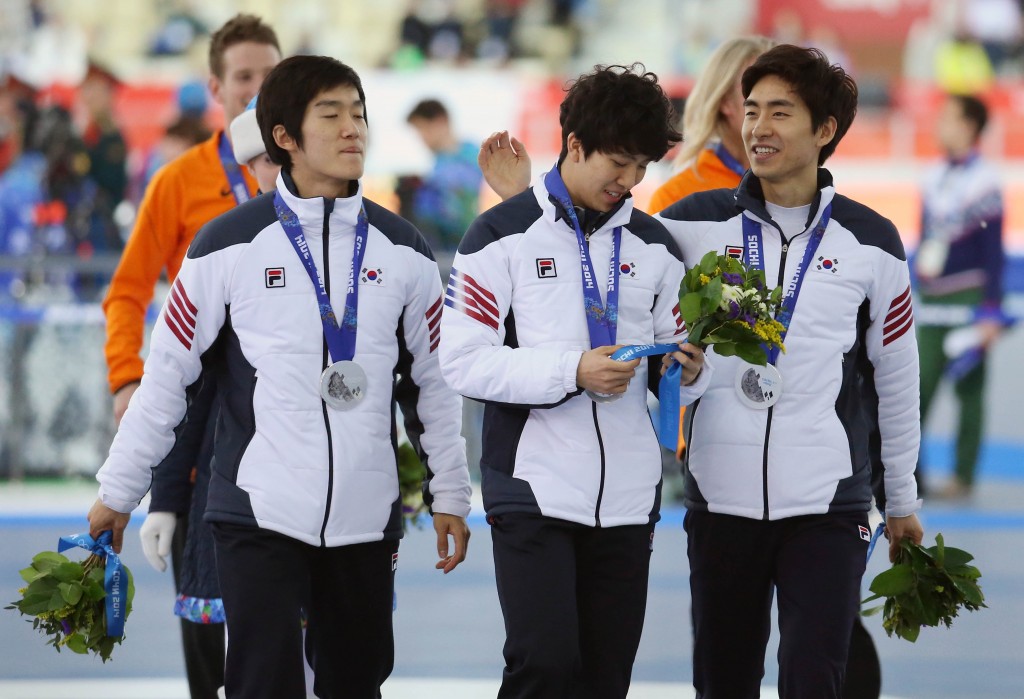 Lee Seung-hoon, from right,  Kim Cheol-min and Joo Hyong-jun smile after getting their silver medals. (Yonhap)