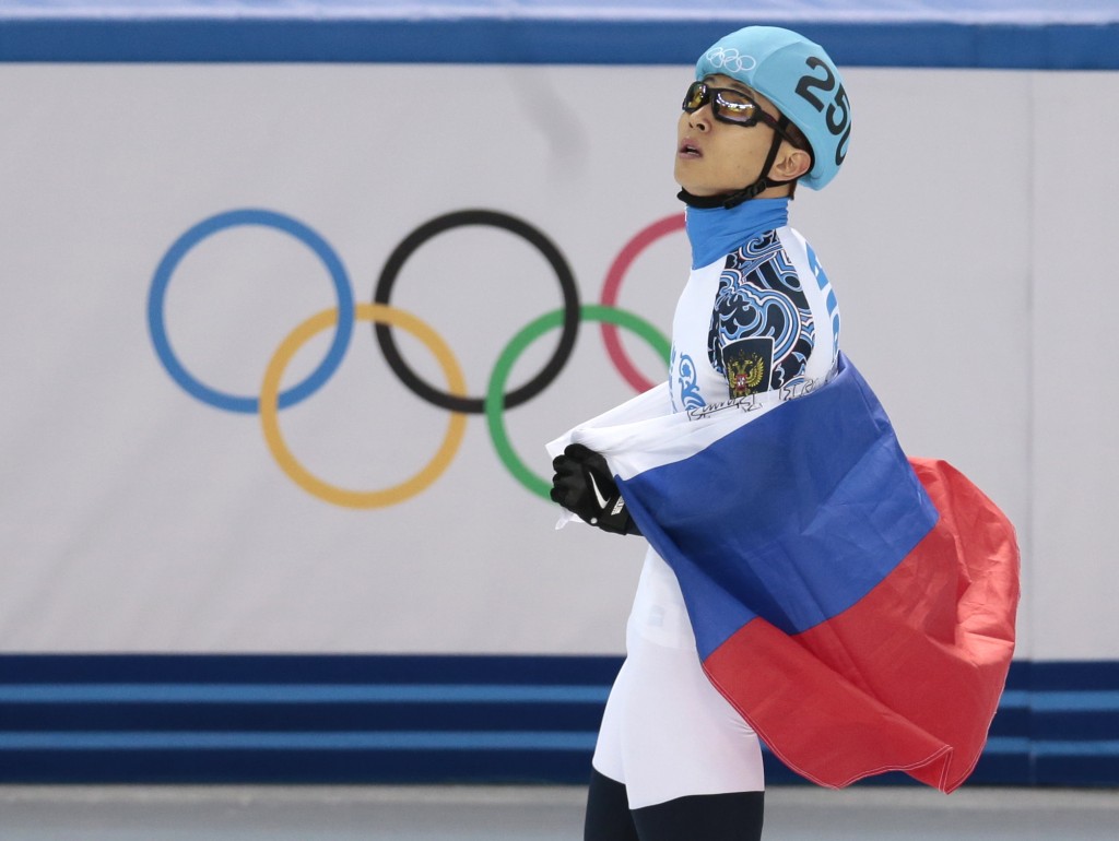 Viktor Ahn of Russia celebrates placing third in the men's 1500m short track speedskating final at the Iceberg Skating Palace during the 2014 Winter Olympics, Monday, Feb. 10, 2014, in Sochi, Russia. (AP Photo/Ivan Sekretarev)