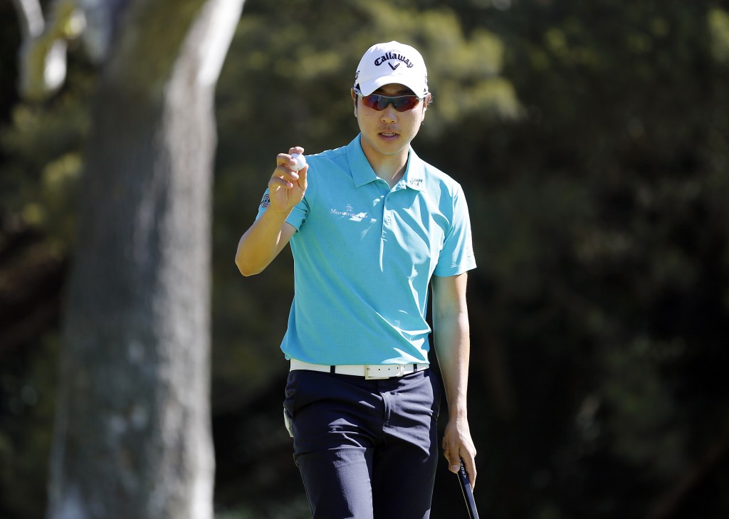 Bae Sang-moon, of South Korea, waves after saving par on the 12th green during the second round of the Northern Trust Open golf tournament at Riviera Country Club in the Pacific Palisades area of Los Angeles Friday, Feb. 14, 2014.  (AP Photo/Reed Saxon)