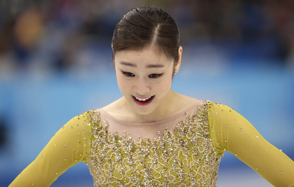Kim Yuna of South Korea reacts after completing her routine in the women's short program figure skating competition at the Iceberg Skating Palace during the 2014 Winter Olympics, Wednesday, Feb. 19, 2014, in Sochi, Russia. (AP Photo/Bernat Armangue)
