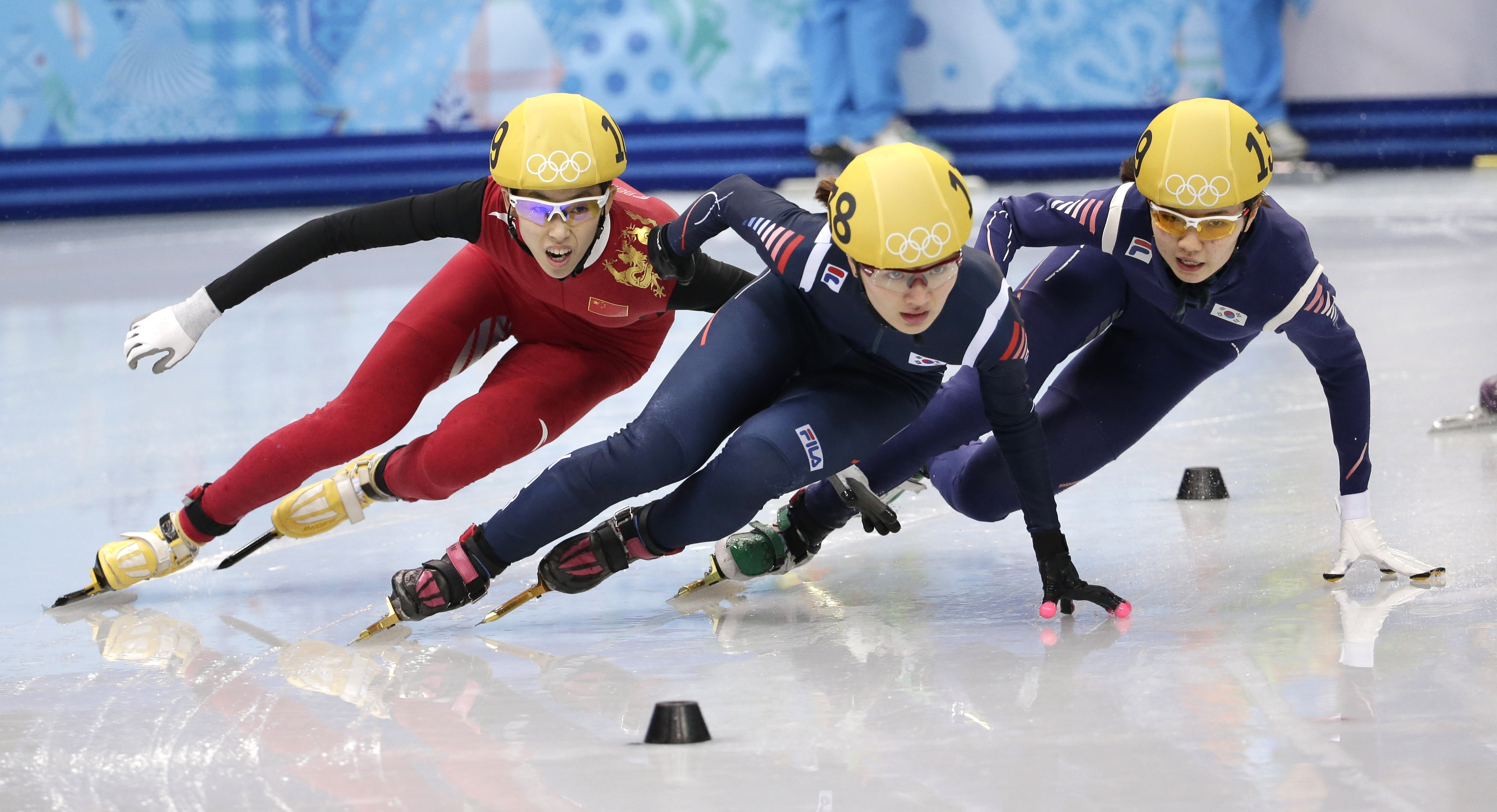 From left, Fan Kexin of China, Park Seung-hi of South Korea and Shim Suk-Hee of South Korea compete in the women's 1000m short track speedskating final at the Iceberg Skating Palace during the 2014 Winter Olympics, Friday, Feb. 21, 2014, in Sochi, Russia. (AP Photo/Bernat Armangue)