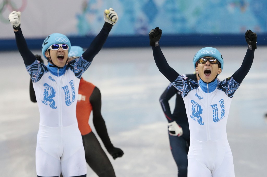 Viktor Ahn of Russia, right, celebrates winning in a men's 1000m short track speedskating final with second placed Vladimir Grigorev of Russia, left, at the Iceberg Skating Palace during the 2014 Winter Olympics, Saturday, Feb. 15, 2014, in Sochi, Russia. (AP Photo/Ivan Sekretarev) 