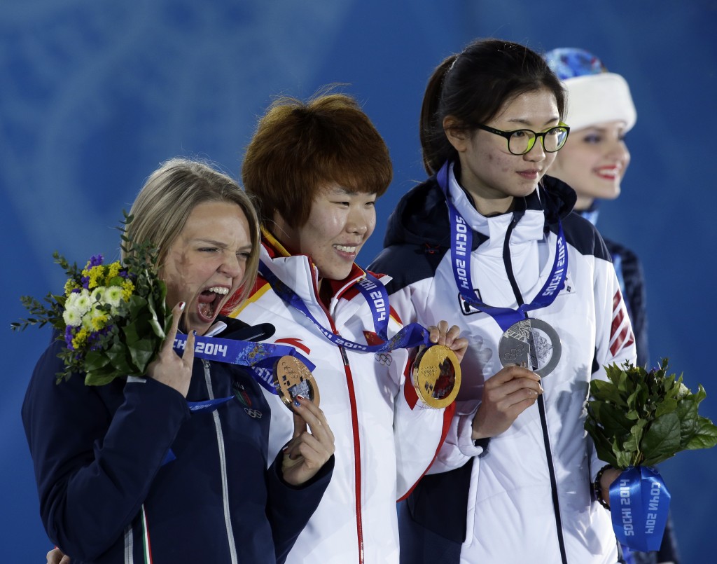 Women's 1,500-meter short track speedskating medalists, from left, Italy's Arianna Fontana, bronze, China's Zhou Yang, gold, and South Korea's Shim Suk-hee, silver, pose with their medals at the 2014 Winter Olympics in Sochi, Russia, Saturday, Feb. 15, 2014. (AP Photo/Morry Gash)