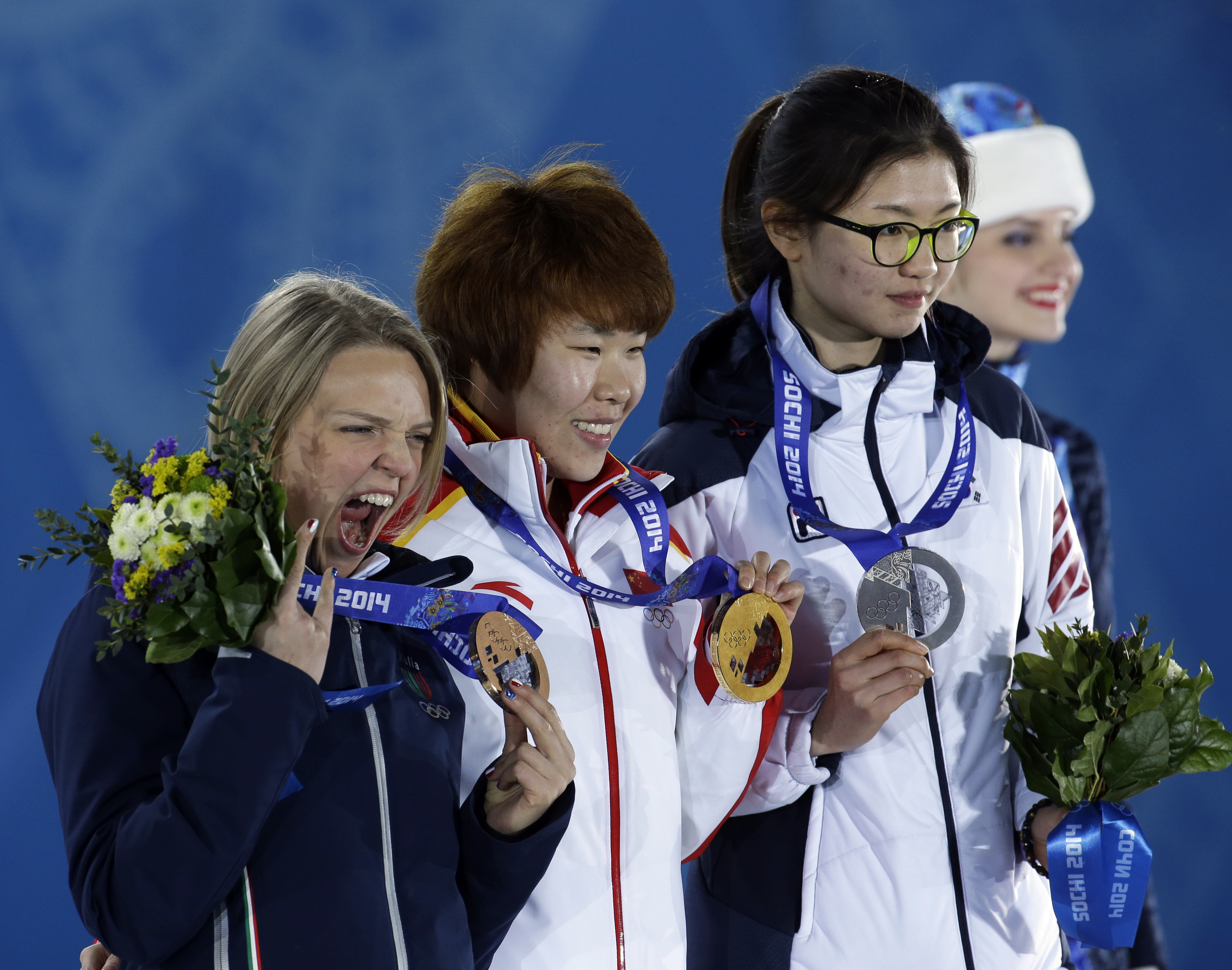 Women's 1,500-meter short track speedskating medalists, from left, Italy's Arianna Fontana, bronze, China's Zhou Yang, gold, and South Korea's Shim Suk-hee, silver, pose with their medals at the 2014 Winter Olympics in Sochi, Russia, Saturday, Feb. 15, 2014.  (AP Photo/Morry Gash)