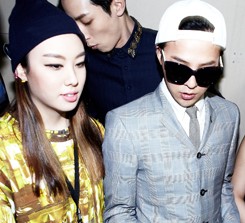 Kathleen Kye, left, enters a showroom with her long time patrons G-Dragon and Ciel at her 2013 Fall/Winter collection, at the Seoul Fashion Week, held
in March 2013. (Courtesy of Kathleen Kye)