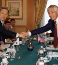 U.S. Defense Secretary Chuck Hagel, right, shakes hands with South Korea's Defense Minister Kim Kwan-jin during their bilateral meeting in Bandar Seri Begawan, Brunei, Wednesday, Aug. 28, 2013. (AP Photo/Vincent Thian/Yonhap)