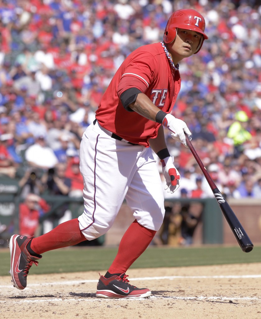 Texas Rangers' Shin-Soo Choo is walked during the seventh inning of an opening day baseball game against the Philadelphia Phillies at Globe Life Park, Monday, March 31, 2014, in Arlington, Texas.  (AP Photo/Tony Gutierrez)