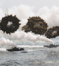 South Korean marine LVT-7 landing craft sail to shores through smoke screens during the U.S.-South Korea joint military exercises called Ssangyong,  part of the Foal Eagle military exercises, in Pohang, South Korea, Monday, March 31, 2014.  South Korea said North Korea has announced plans to conduct live-fire drills near the rivals' disputed western sea boundary. The planned drills Monday come after an increase in threatening rhetoric from Pyongyang and a series of rocket and ballistic missile launches in an apparent protest against the annual military exercises by Seoul and Washington.(AP Photo/Ahn Young-joon)