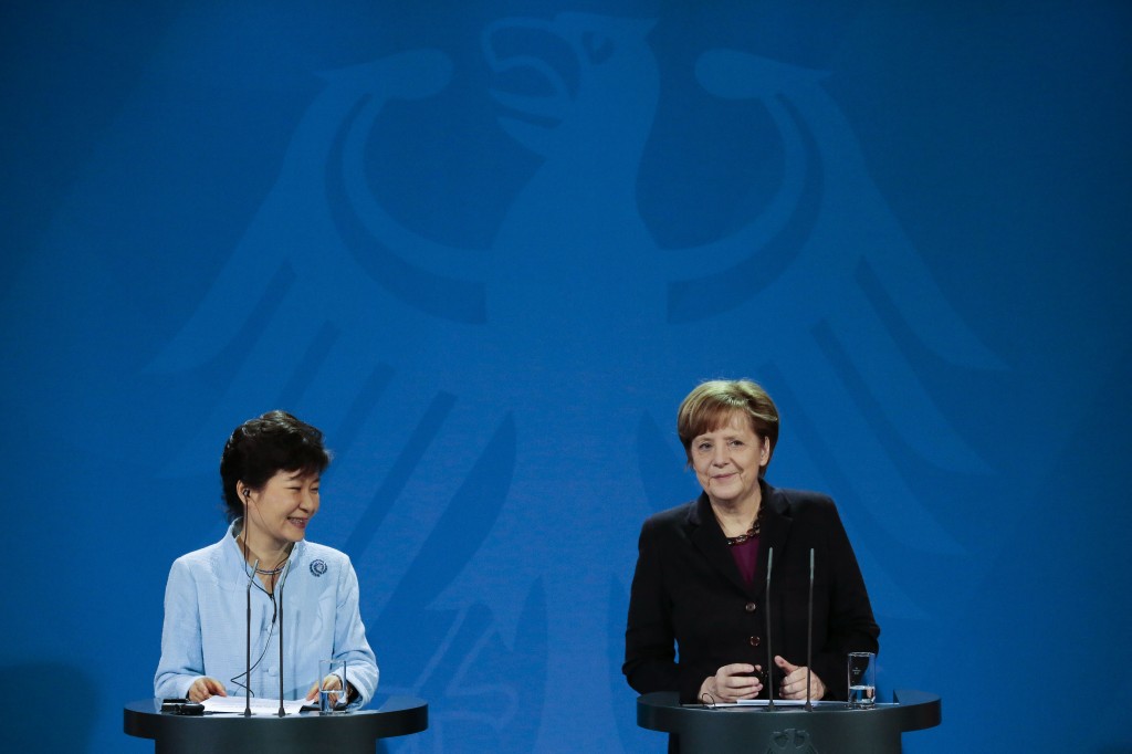 German Chancellor Angela Merkel, right, and the President of South Korea Park Geun-hye brief the media during a meeting at the chancellery in Germany in Berlin, Wednesday, March 26, 2014. The President of South Korea Park Geun-hye is on a three days official visit in Germany. (AP Photo/Markus Schreiber)