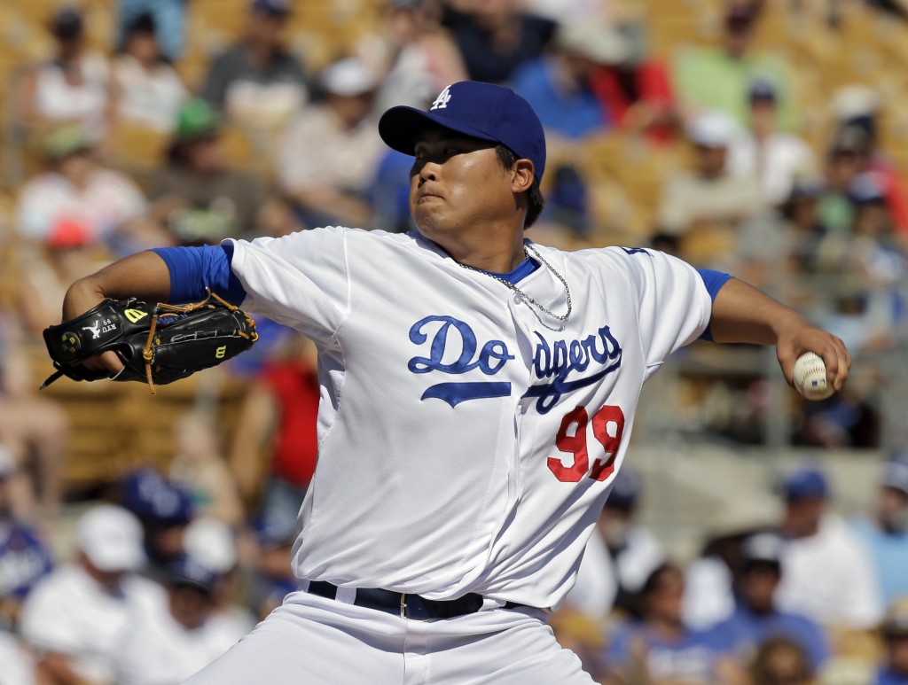 Los Angeles Dodgers starting pitcher Ryu Hyun-Jin, from South Korea, delivers against the Oakland Athletics in the fifth inning of a spring exhibition baseball game, Monday, March 10, 2014, in Glendale, Ariz. (AP Photo/Mark Duncan)