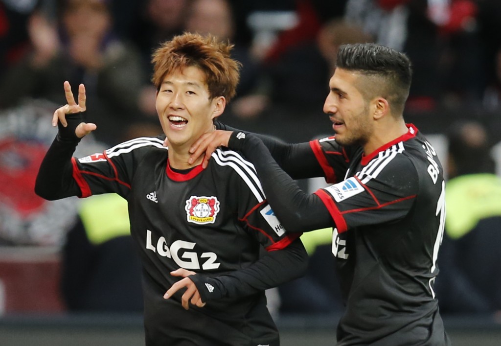 Leverkusen's Son Heung-min  of South Korea, left, and Leverkusen's Emre Can celebrate after scoring during the German first division Bundesliga soccer match between Bayer Leverkusen and Hamburger  SV  last year. 