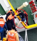 Sewol Captain Lee Joon-seok in his underwear is being rescued from the ship as it capsizes by first responders in this still from a video capturing the sinking of the ferry on April 16, which was released by the Coast Guard, Monday. While Lee and other crewmembers were taking flight, other footage shows few people on the decks, with hundreds of students heeding the crew’s instructions and staying inside their cabins. Over 300 people, mostly students on a school trip, have been confirmed dead or listed as missing.
/ Yonhap