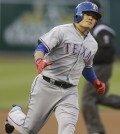 Texas Rangers'  Choo Shin-Soo of Korea runs the bases after hitting a home run off Oakland Athletics' Dan Straily in the first inning of a baseball game Monday, April 21, 2014, in Oakland, Calif. (AP Photo/Ben Margot)