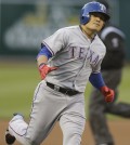 Texas Rangers'  Choo Shin-Soo of Korea runs the bases after hitting a home run off Oakland Athletics' Dan Straily in the first inning of a baseball game Monday, April 21, 2014, in Oakland, Calif. (AP Photo/Ben Margot)