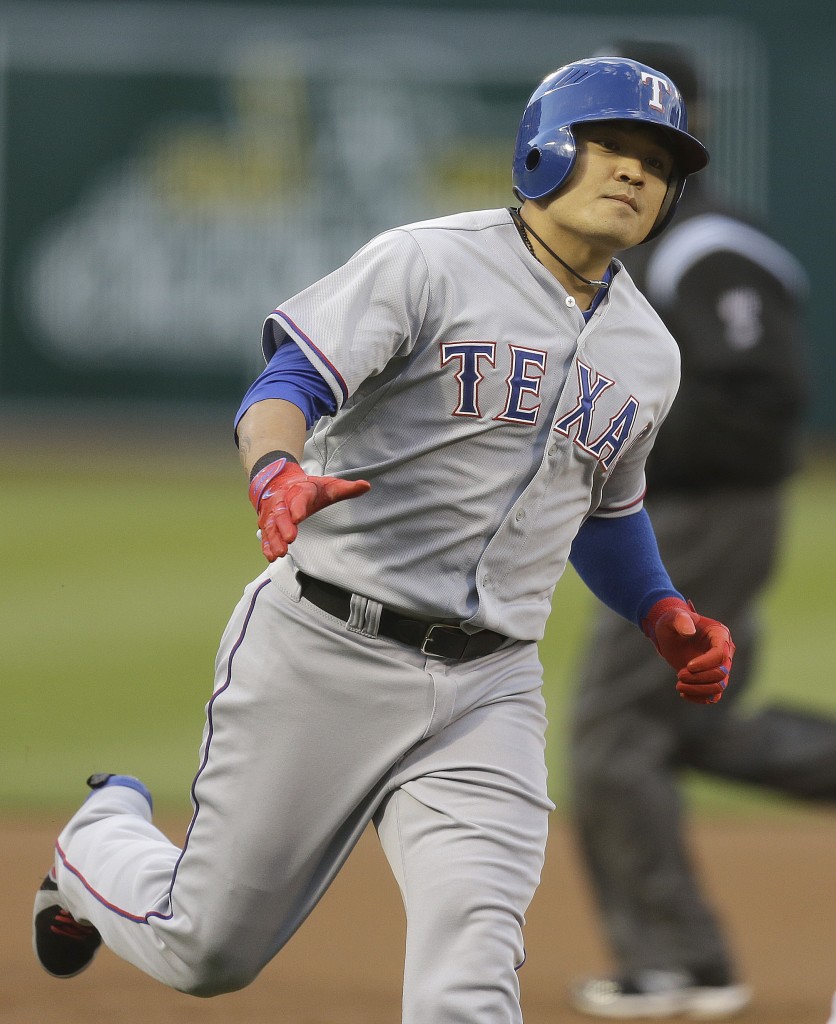 Texas Rangers'  Choo Shin-Soo of Korea runs the bases after hitting a home run off Oakland Athletics' Dan Straily in the first inning of a baseball game Monday, April 21, 2014, in Oakland, Calif. (AP Photo/Ben Margot)