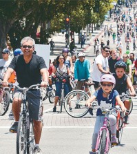 "CicLAvia temporarily removes cars from L.A. streets - and the streets fill up with smiles," says the event organizers.
