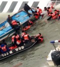 Coast Guard officers carry out rescue operations on the sunken ferry, Sewol, in waters off the southern coast, Wednesday. / Yonhap