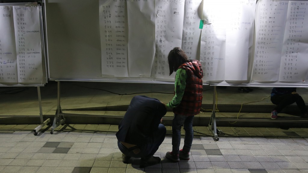 A man breaks down after checking the list. (Yonhap)