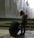 A man breaks down after checking the list. (Yonhap)