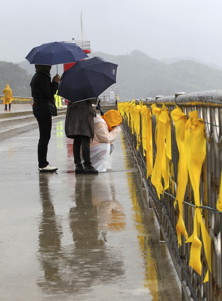 A relative of a passenger aboard the sunken Sewol ferry weeps as she awaits news on her missing loved one at a port in Jindo, South Korea. 