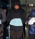 Crew members of the sunken ferry Sewol, including the chief engineer, two chief mates and a second mate, stand in front of reporters after being questioned during a judge’s review of prosecutors’ request for arrest warrants for abandoning passengers, at the Mokpo branch of the Gwangju District Court. (Yonhap)