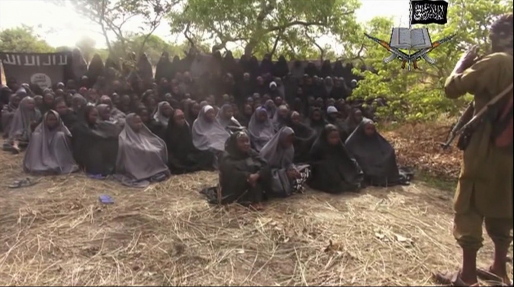 In this  photo taken from video  by Nigeria's Boko Haram terrorist network, Monday May 12, 2014 shows the alleged missing girls abducted from the northeastern town of Chibok. The new video purports to show dozens of abducted schoolgirls, covered in jihab and praying in Arabic. It is the first public sight of the girls since more than 300 were kidnapped from a northeastern school the night of April 14  exactly four weeks ago. (AP Photo)