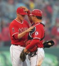Los Angeles Angels relief pitcher Mike Morin, left, and catcher Hank Conger celebrate after they defeated the Cleveland Indians 7-1 following a baseball game, Wednesday, April 30, 2014, in Anaheim, Calif. (AP Photo)