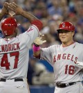 Los Angeles Angels' Hank Conger, right, is congratulated by Howie  Kendrick after hitting a three-run home run off Toronto Blue Jays pitcher Marcus Stroman during sixth-inning baseball game action in Toronto, Sunday, May 11, 2014. (AP Photo/The Canadian Press, Frank Gunn)