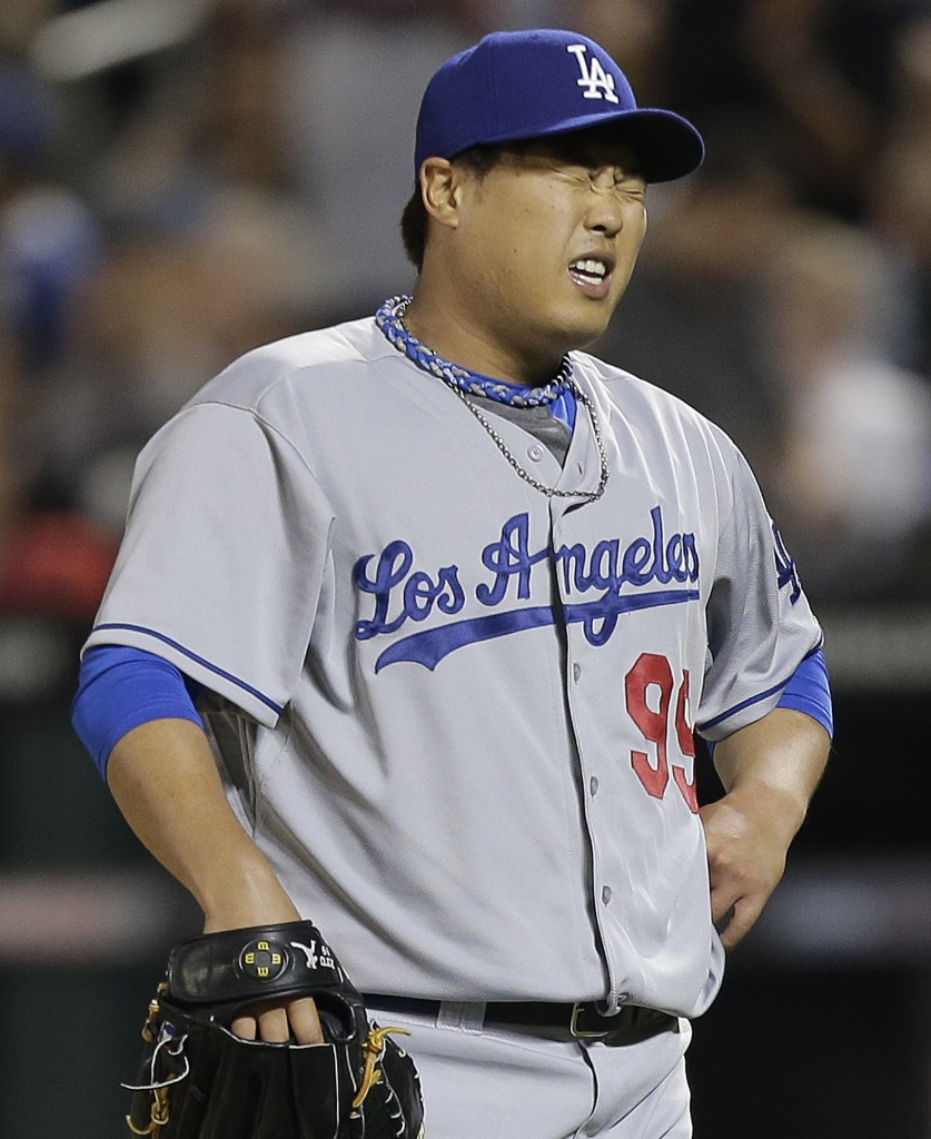 Los Angeles Dodgers pitcher Hyun-Jin Ryu reacts after giving up a two-run home run to New York Mets' Eric Campbell during the sixth inning of a baseball game, Wednesday, May 21, 2014, in New York. (AP Photo/Julie Jacobson)