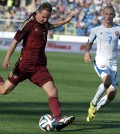 Russia's Aleksei Kozlov, center, and Slovakia's Vladimir Weiss, right, during a friendly soccer match between Russia and Slovakia in St. Petersburg, Russia, Monday, May 26, 2014. Russia won 1-0. (AP)