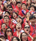 South Korean soccer fans react after Russian soccer team scored a goal against South Korea during  the group H World Cup soccer match between Russia and South Korea, at a public viewing venue in Seoul, South Korea, Wednesday, June 18, 2014. (AP Photo/Ahn Young-joon)