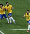 Brazil's Neymar, right, celebrates scoring his side's first goal during the group A World Cup soccer match between Brazil and Croatia, the opening game of the tournament, in the Itaquerao Stadium in Sao Paulo, Brazil, Thursday, June 12, 2014.  (AP Photo/Shuji Kajiyama)