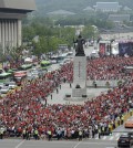 South Korean soccer fans gather to watch a live broadcast of 2014 Brazil World Cup Group H game between South Korea and Russia at a public viewing venue in Seoul, South Korea, Wednesday, June 18, 2014.(AP Photo/Yonhap, Shin June-hee)