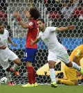 Algeria's Abdelmoumene Djabou celebrates after scoring his side's third goal during the group H World Cup soccer match between South Korea and Algeria at the Estadio Beira-Rio in Porto Alegre, Brazil, Sunday, June 22, 2014. (AP Photo/Martin Meissner)